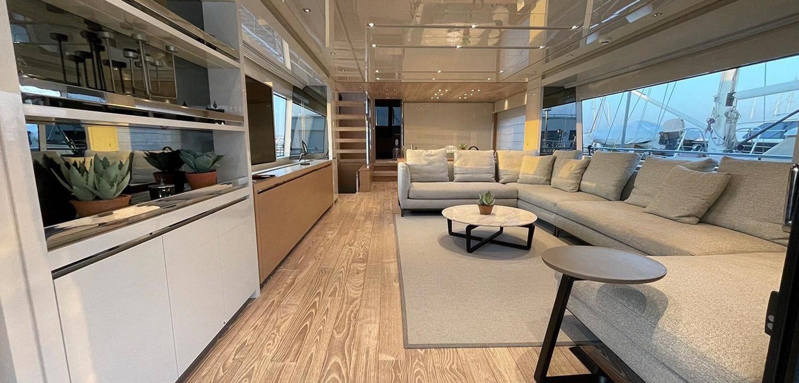 a living room with a couch and a table aboard Y2 Yacht for Sale