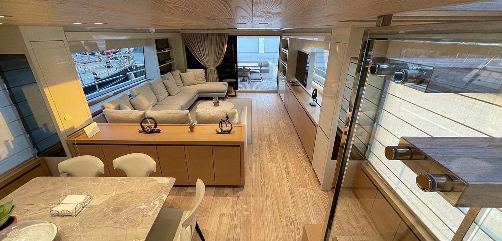 a room with a table and chairs aboard Y2 Yacht for Sale