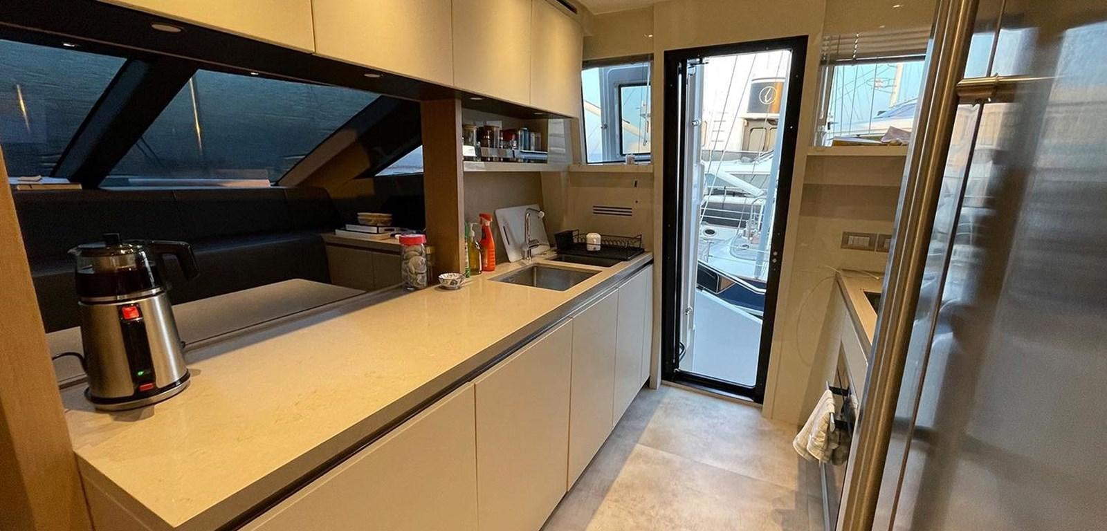 a kitchen with a glass door aboard Y2 Yacht for Sale