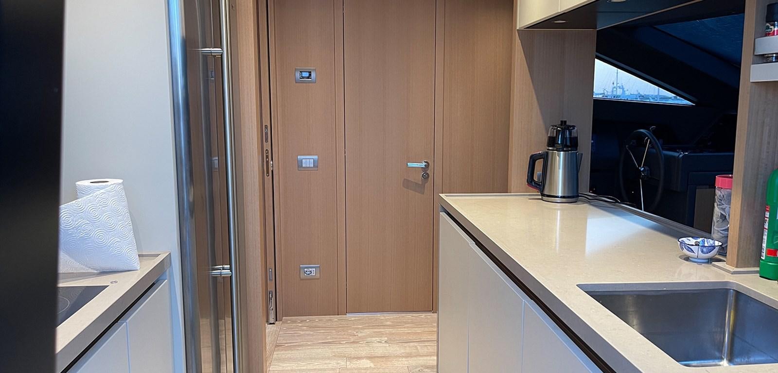 a kitchen with a sink and a microwave aboard Y2 Yacht for Sale