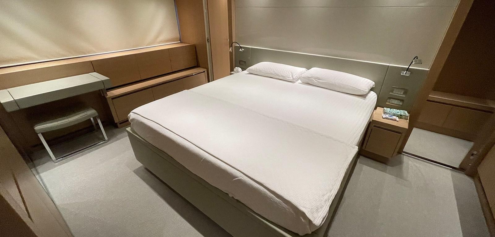 a bed in a room aboard Y2 Yacht for Sale
