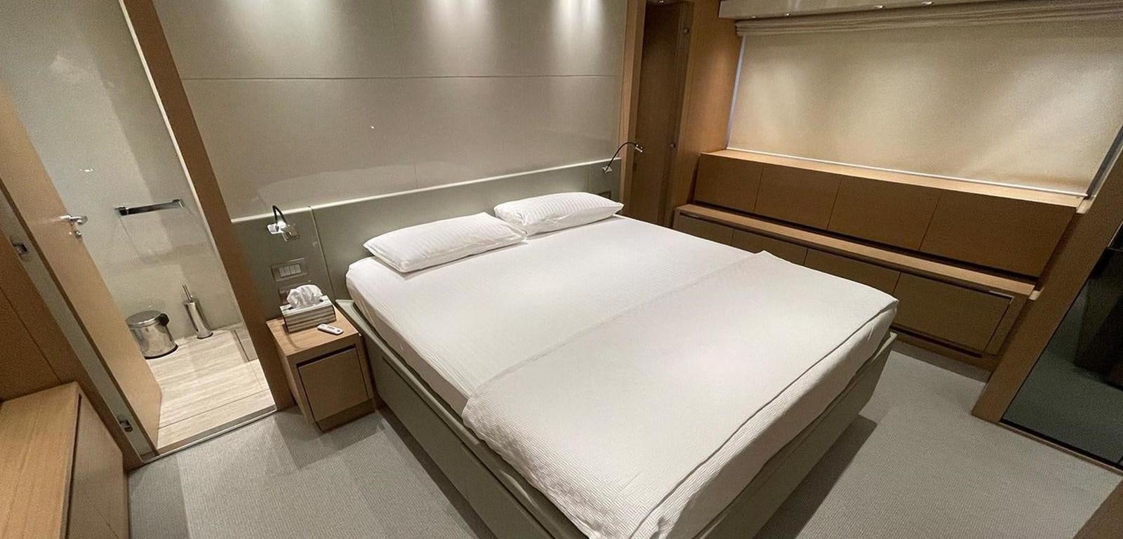 a room with a bed and a mirror aboard Y2 Yacht for Sale