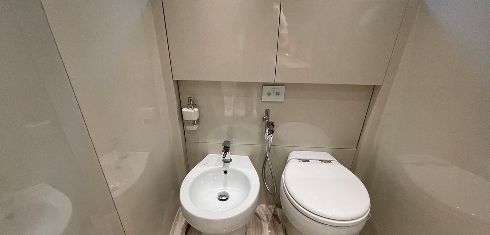 a bathroom with a toilet and sink aboard Y2 Yacht for Sale