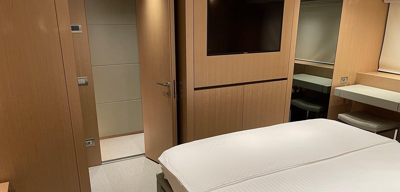 a room with a bed and a closet aboard Y2 Yacht for Sale