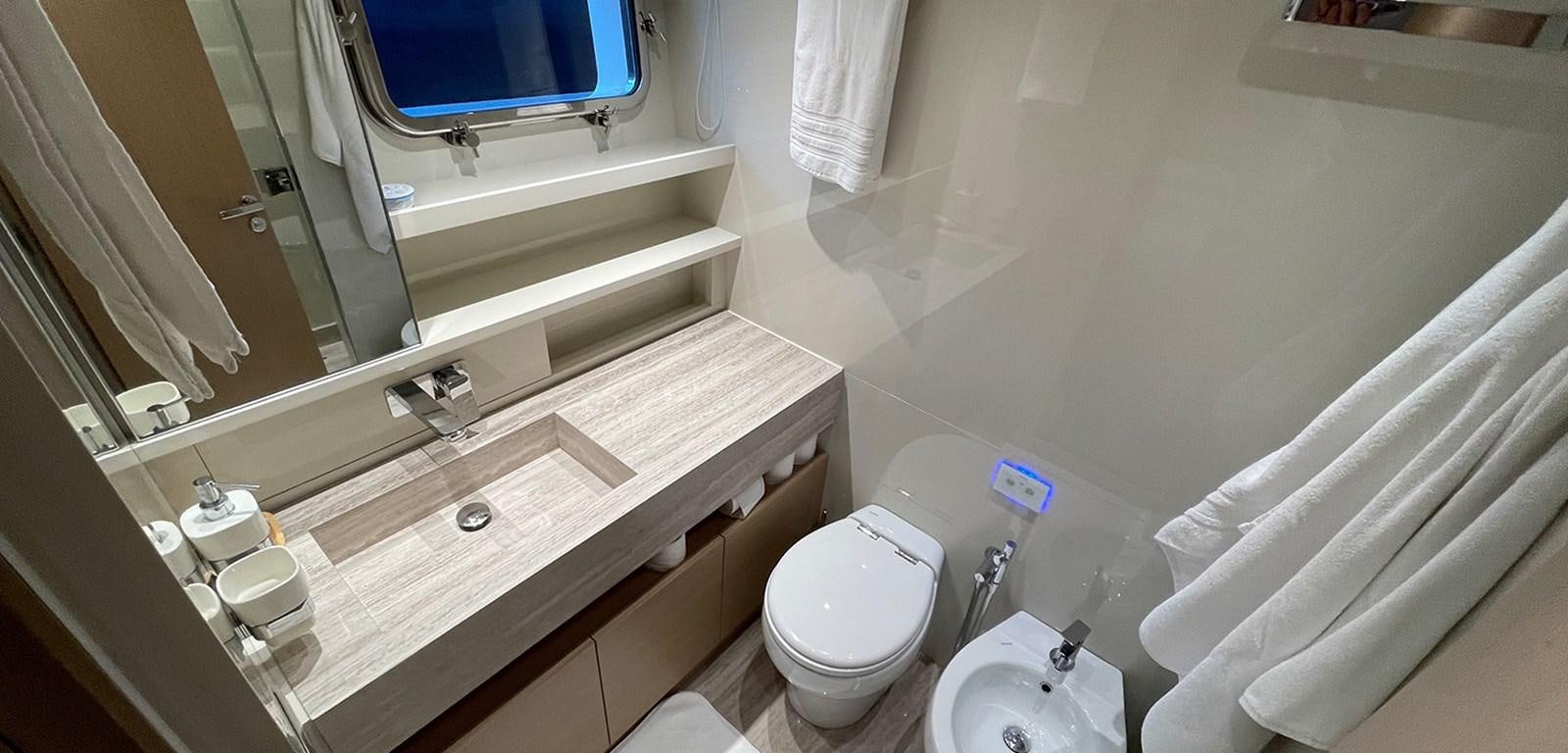 a bathroom with a toilet and a sink aboard Y2 Yacht for Sale