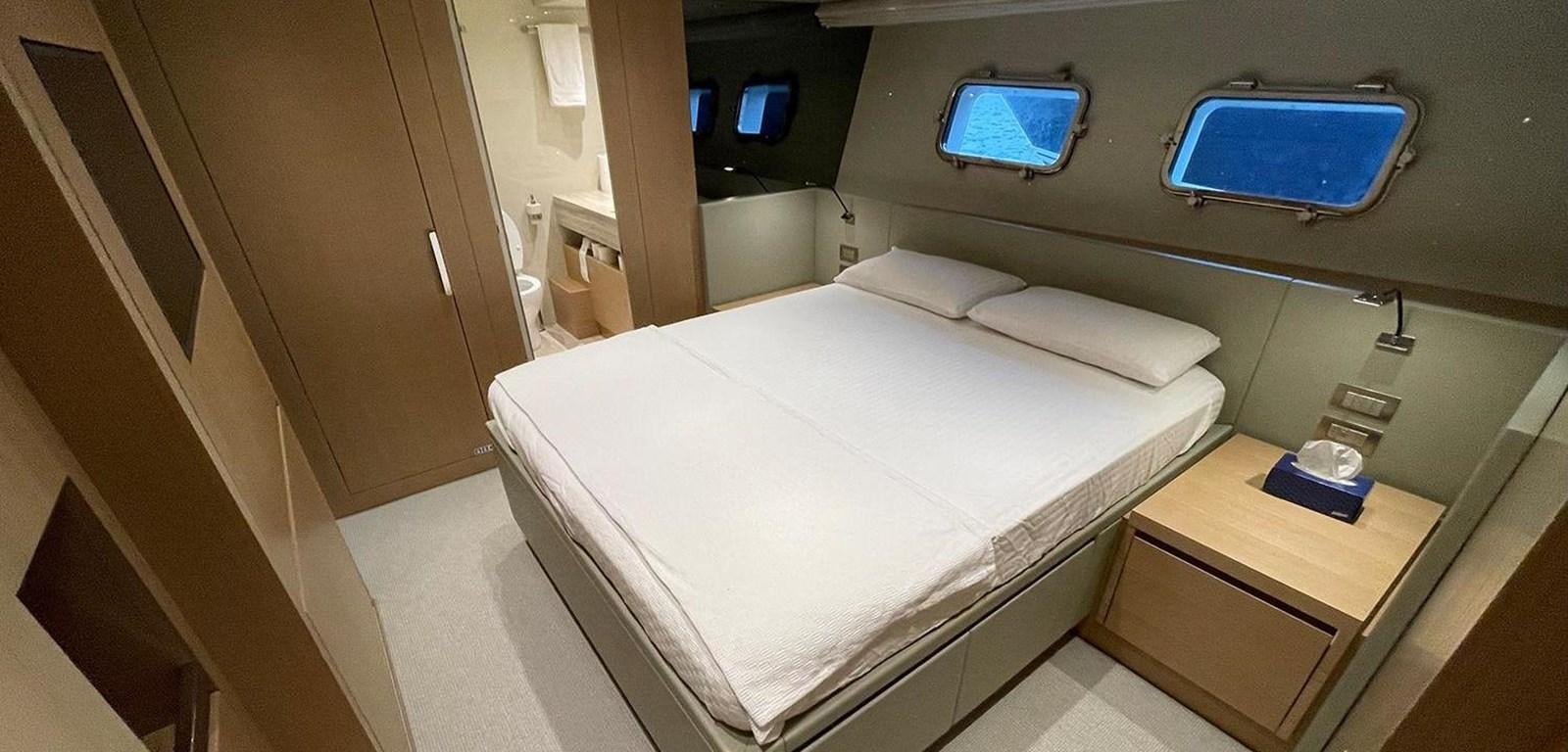a bed in a room aboard Y2 Yacht for Sale