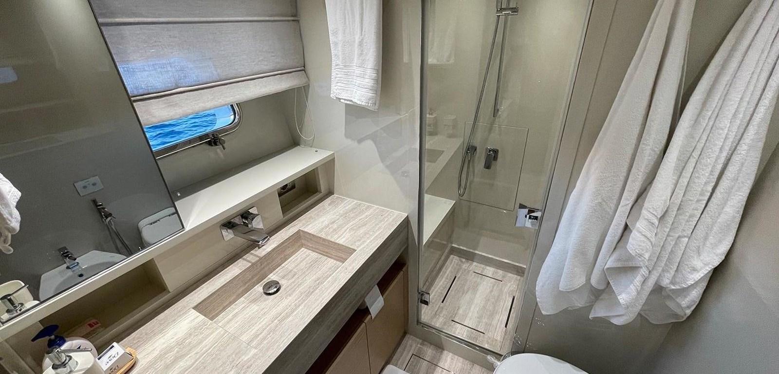 a bathroom with a sink and a shower aboard Y2 Yacht for Sale