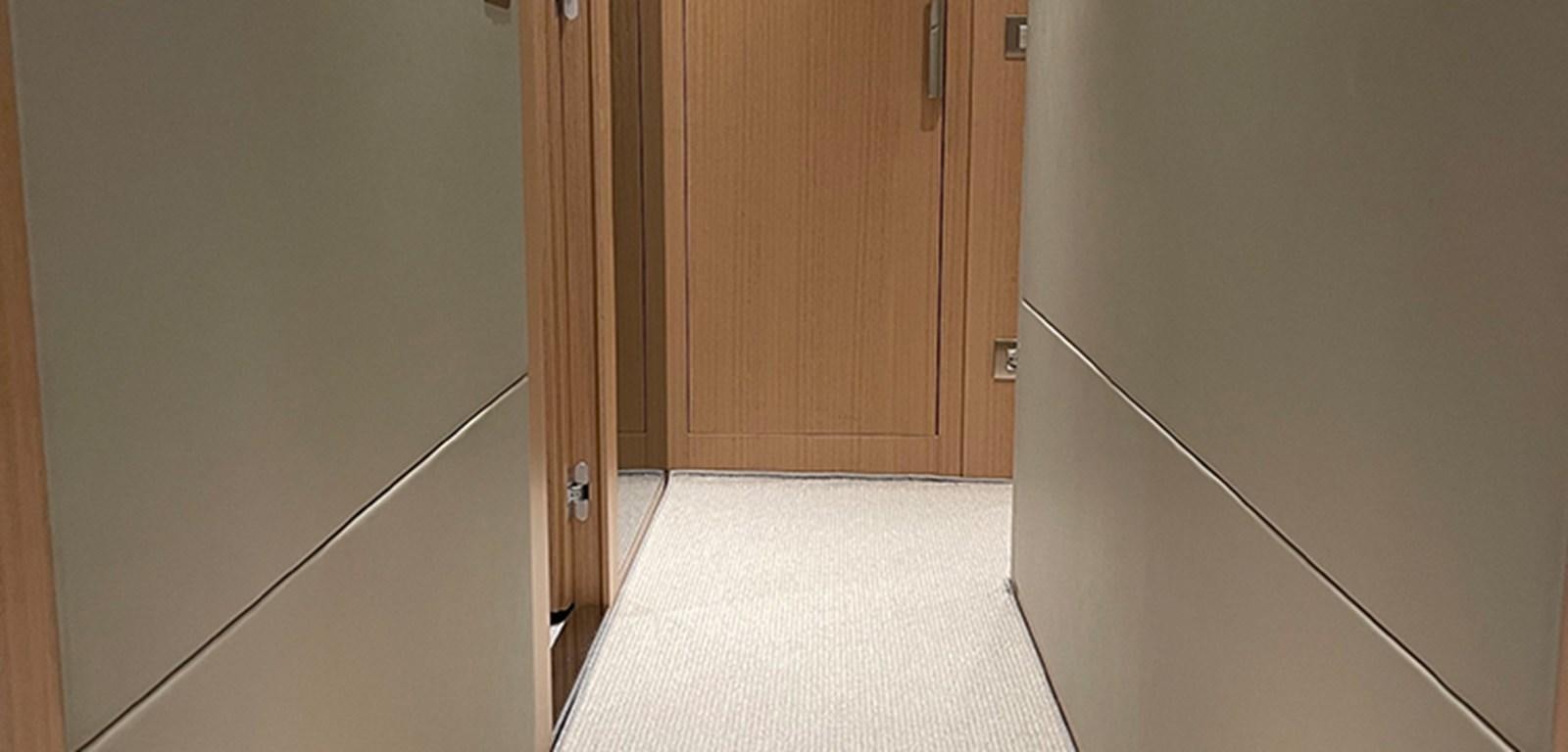 a hallway with a door and a hallway aboard Y2 Yacht for Sale