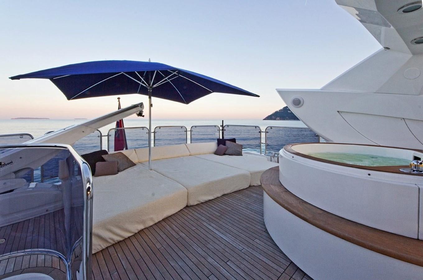 a boat with a deck and umbrella aboard DONIZETTI Yacht for Sale