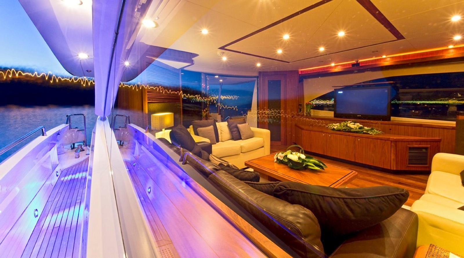 a large living room with a large pool table and couches aboard DONIZETTI Yacht for Sale
