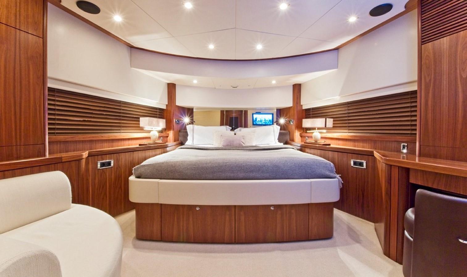 a bedroom with a bed and a desk aboard DONIZETTI Yacht for Sale