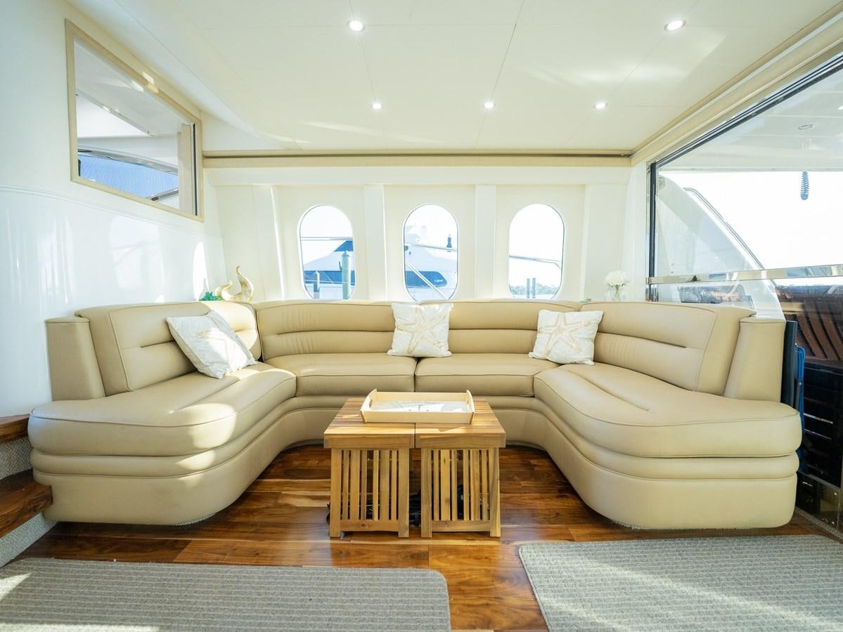 a living room with a couch and a table aboard ANGEL DEL MAR Yacht for Sale