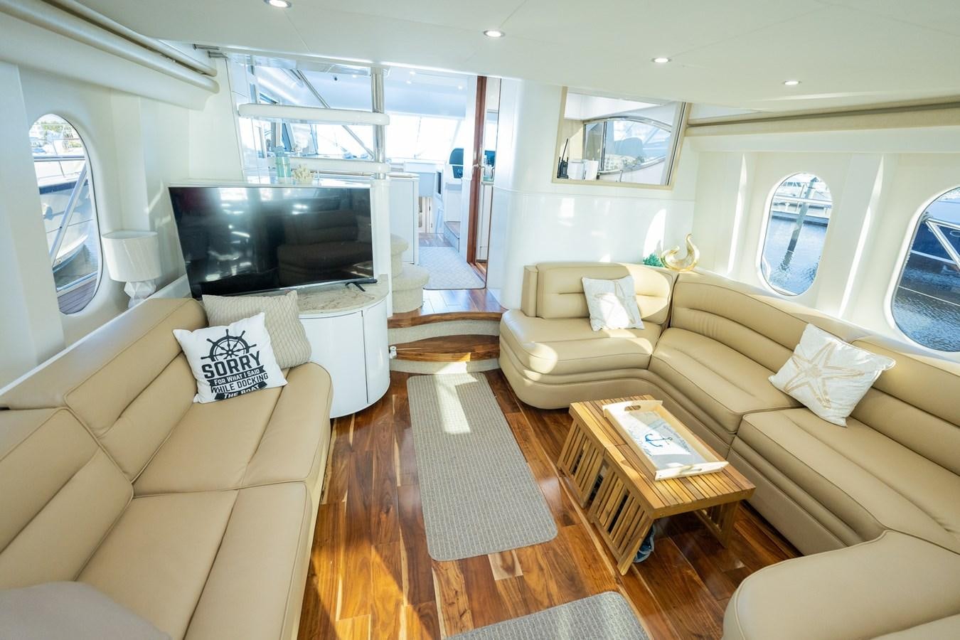 a living room with a couch and a tv aboard ANGEL DEL MAR Yacht for Sale