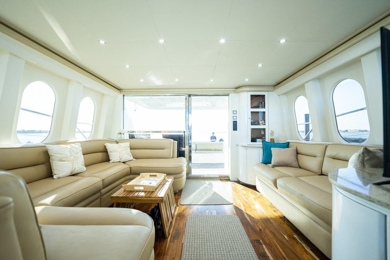 a living room with a couch and a coffee table aboard ANGEL DEL MAR Yacht for Sale