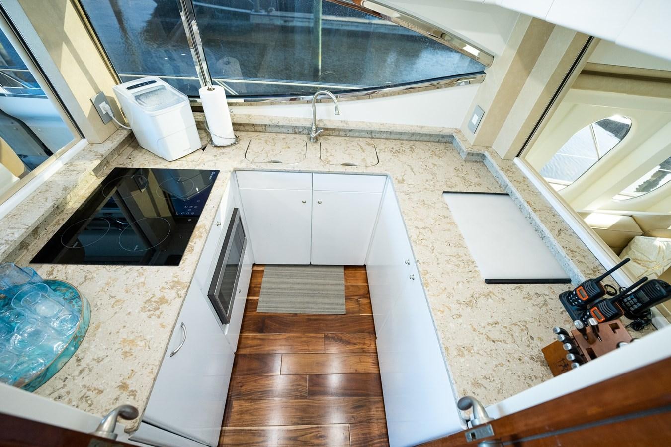 a kitchen with a wooden floor aboard ANGEL DEL MAR Yacht for Sale