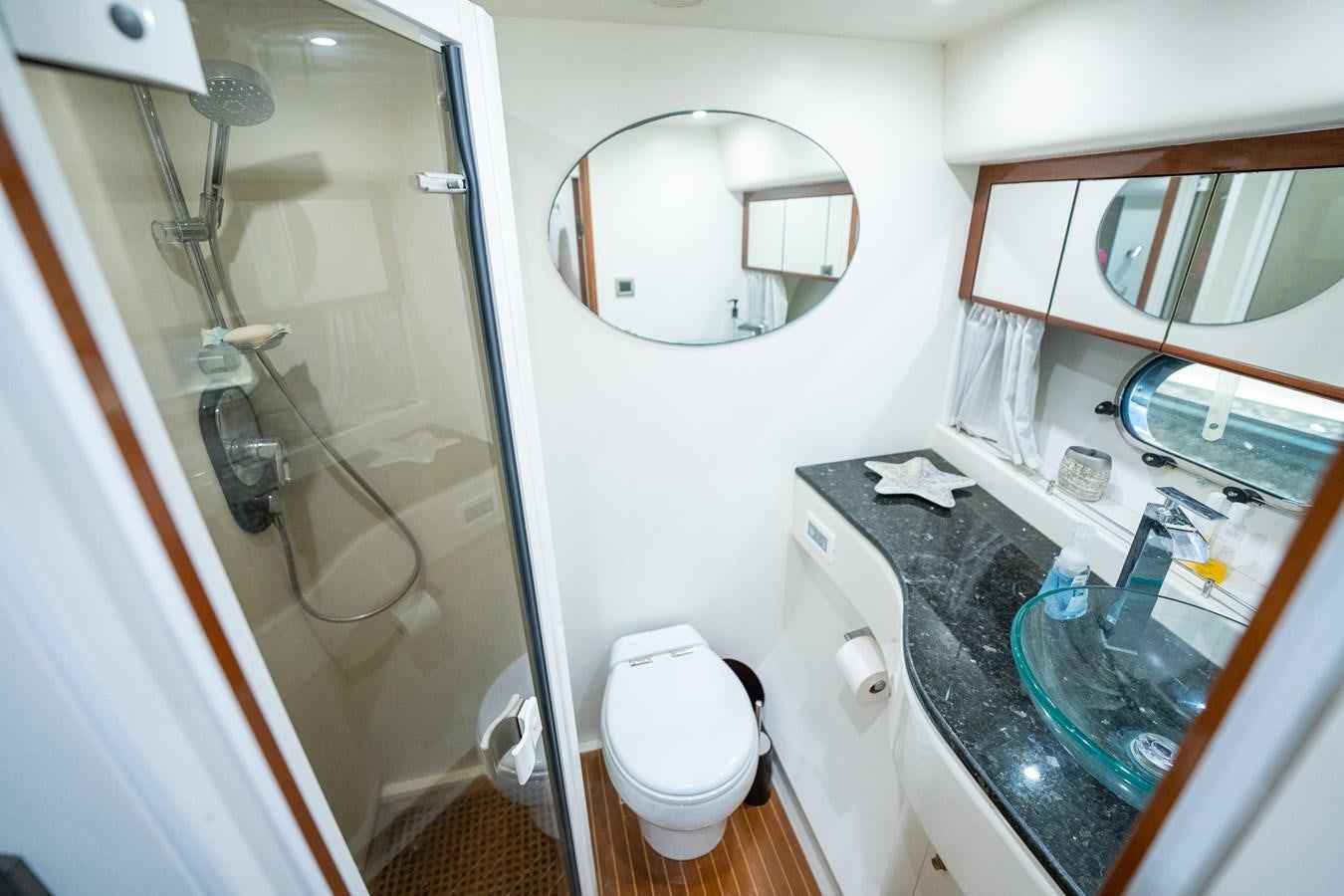 a bathroom with a glass shower aboard ANGEL DEL MAR Yacht for Sale
