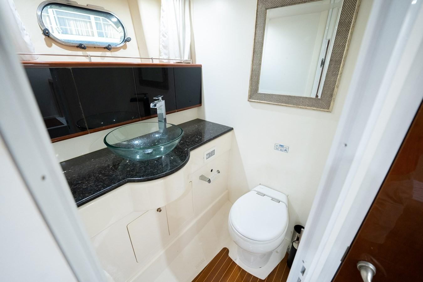 a bathroom with a sink and a toilet aboard ANGEL DEL MAR Yacht for Sale