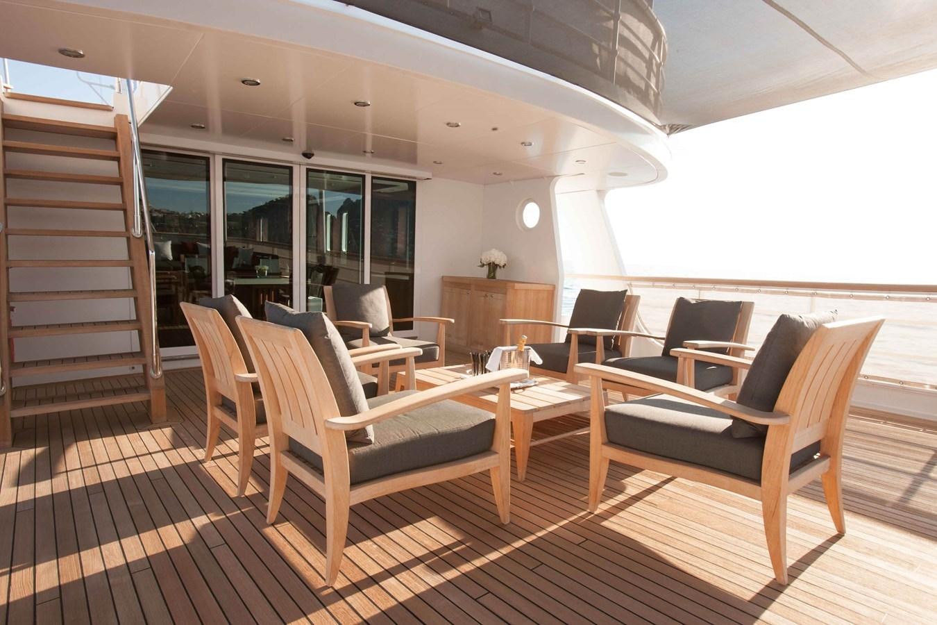 a room with chairs and a table aboard ICE LADY Yacht for Sale