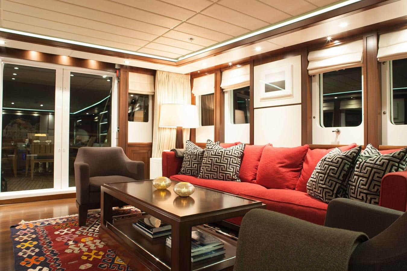 a living room with a couch and a coffee table aboard ICE LADY Yacht for Sale