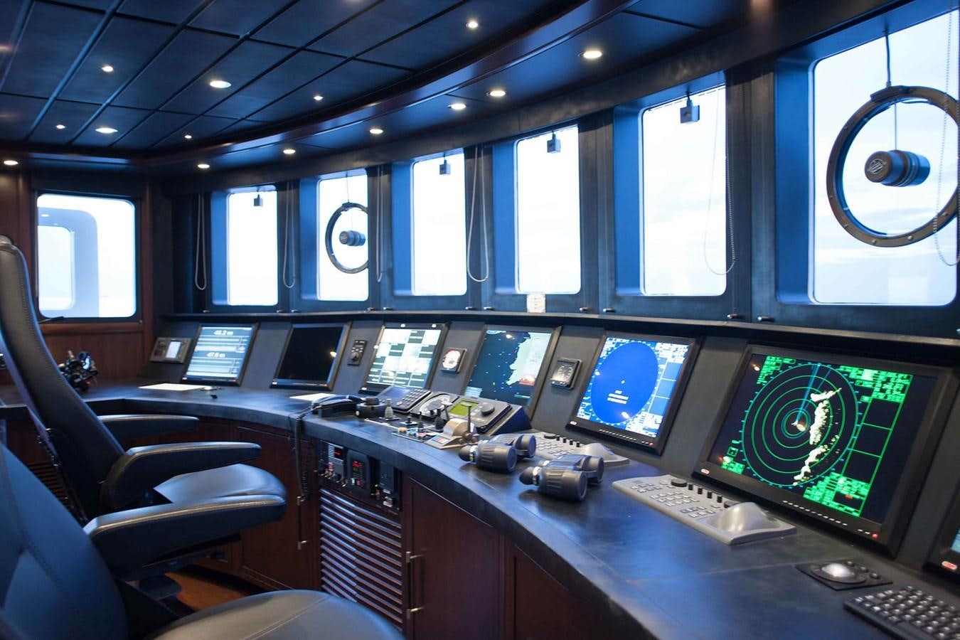 a control room with many monitors aboard ICE LADY Yacht for Sale