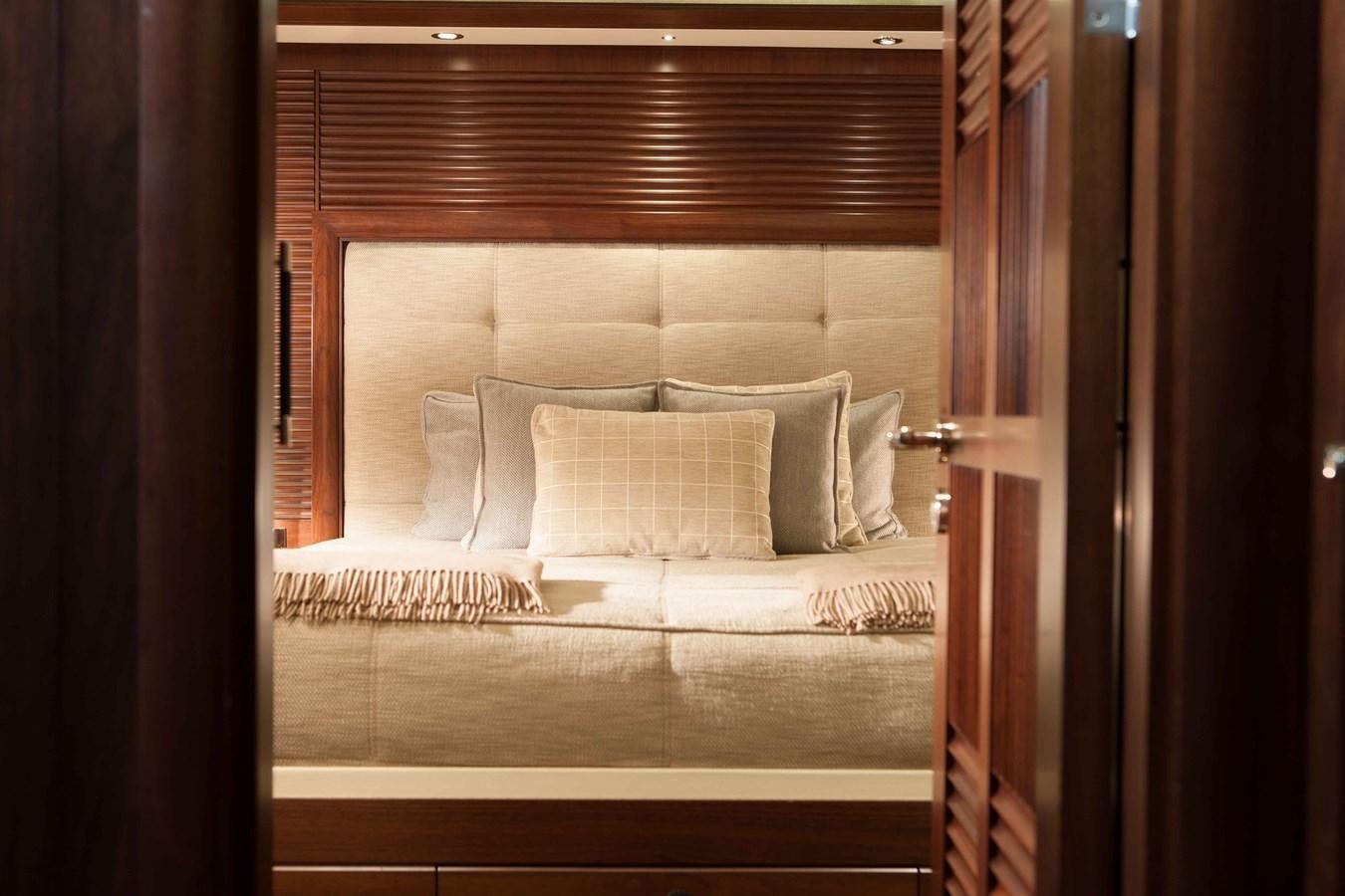 a bed with pillows aboard ICE LADY Yacht for Sale