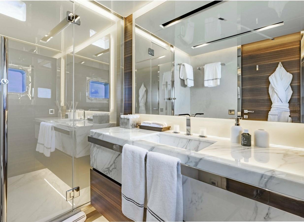 a bathroom with a large mirror aboard SAFE HAVEN Yacht for Charter