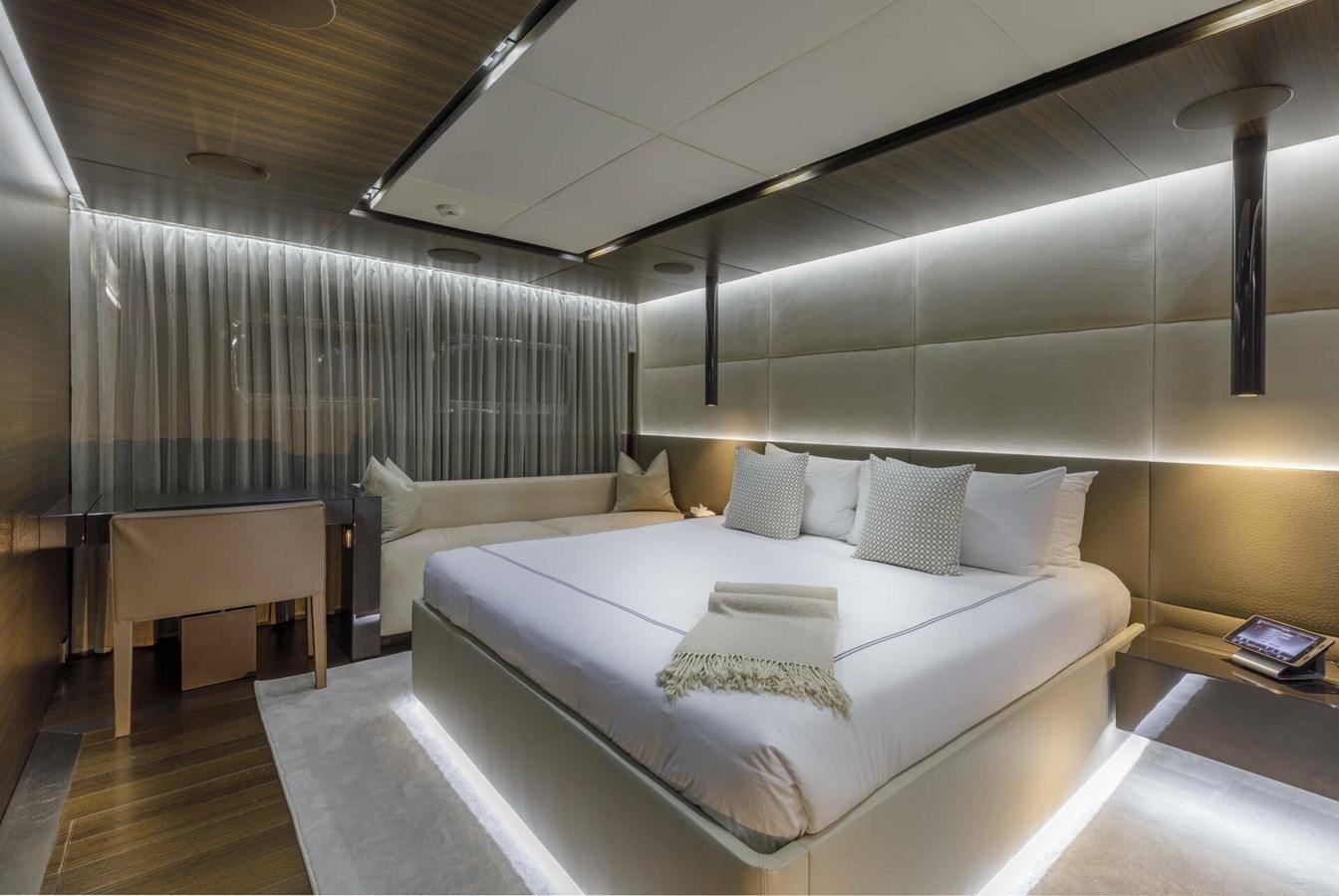 a room with a bed and a desk aboard SAFE HAVEN Yacht for Charter