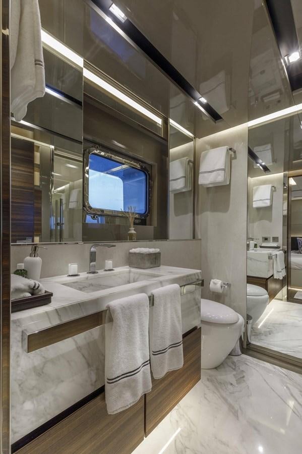 a bathroom with a large mirror aboard SAFE HAVEN Yacht for Charter