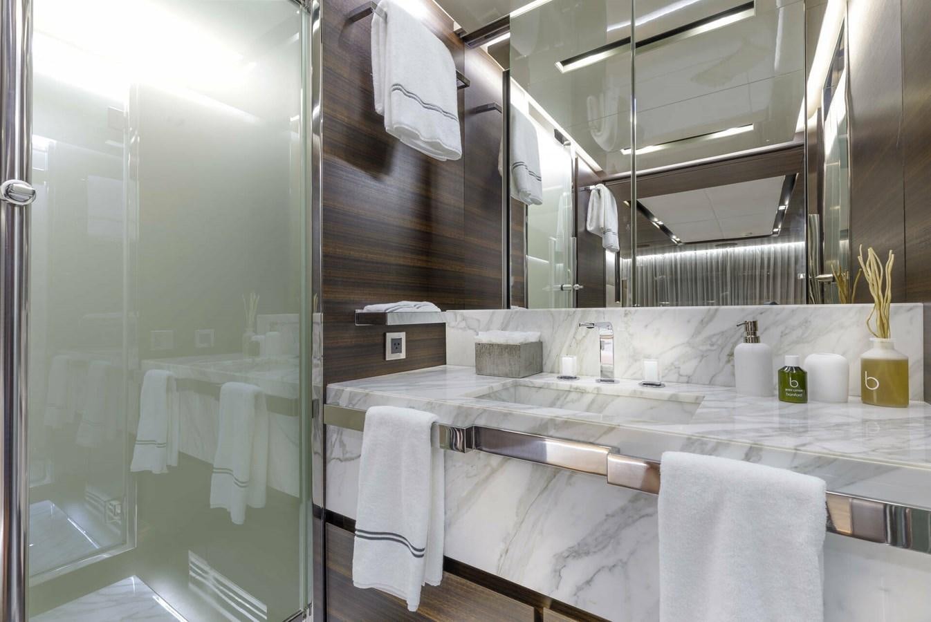 a bathroom with a large mirror aboard SAFE HAVEN Yacht for Charter