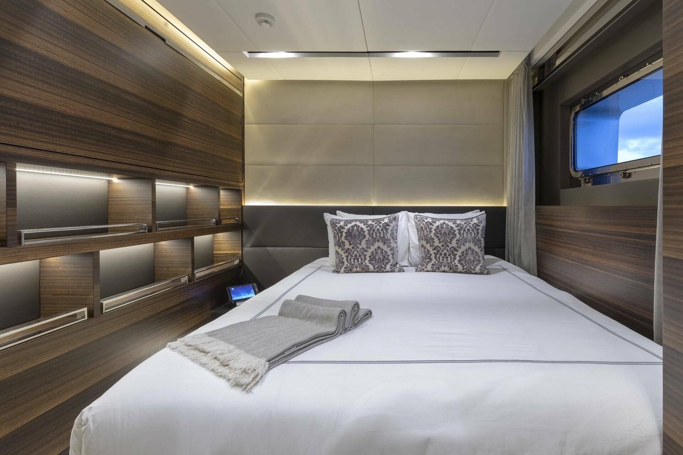 a bed with pillows on it aboard SAFE HAVEN Yacht for Charter