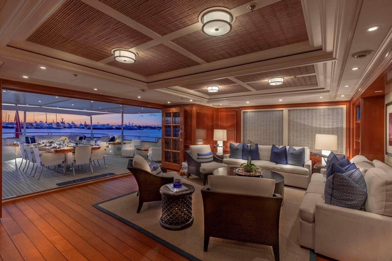 a living room with a large window aboard FABULOUS CHARACTER Yacht for Sale