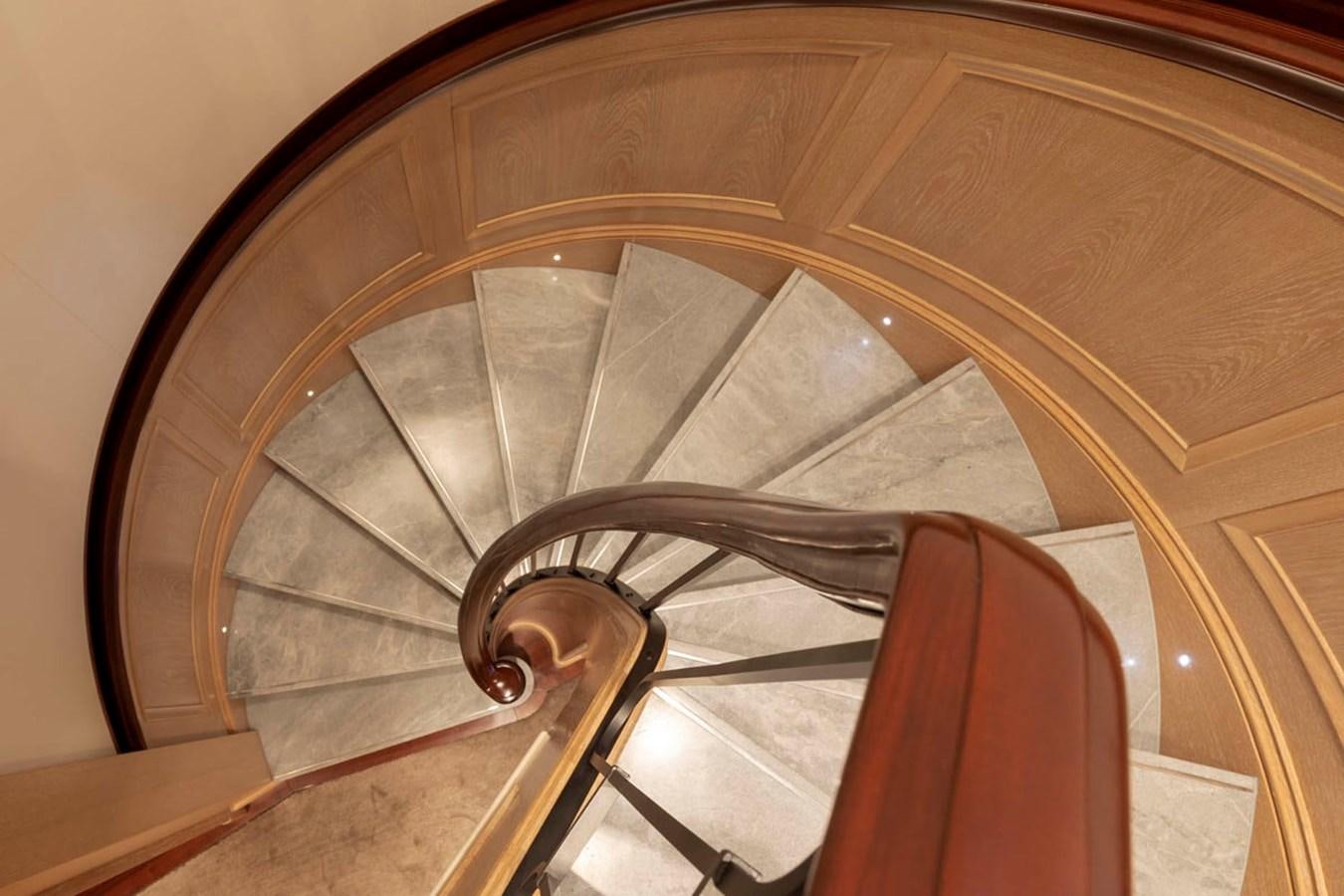 a wooden staircase with a railing aboard FABULOUS CHARACTER Yacht for Sale