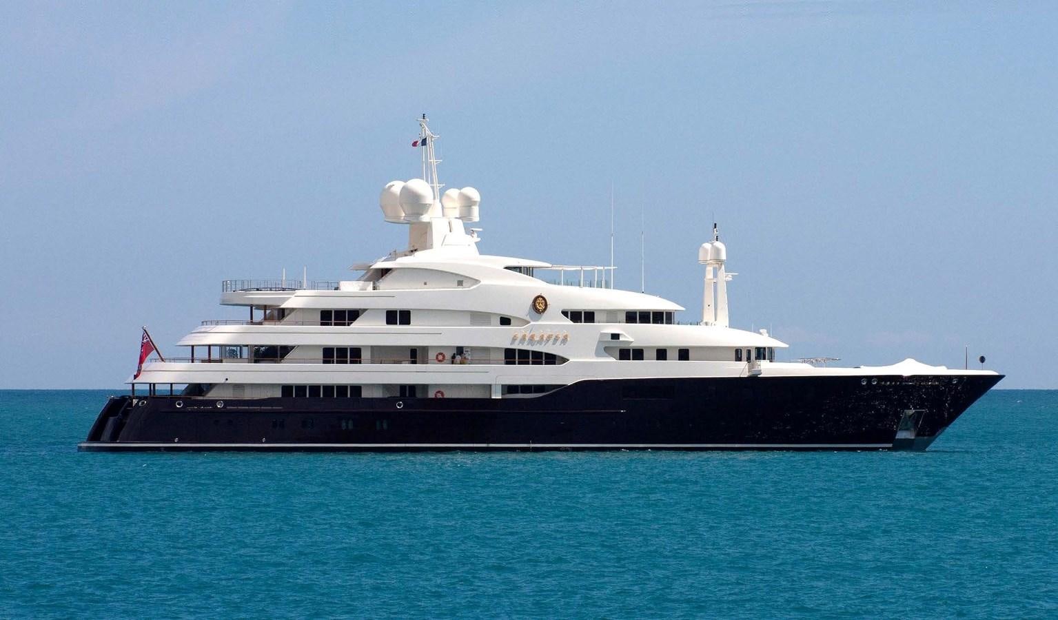 a large ship in the water aboard PURE Yacht for Sale