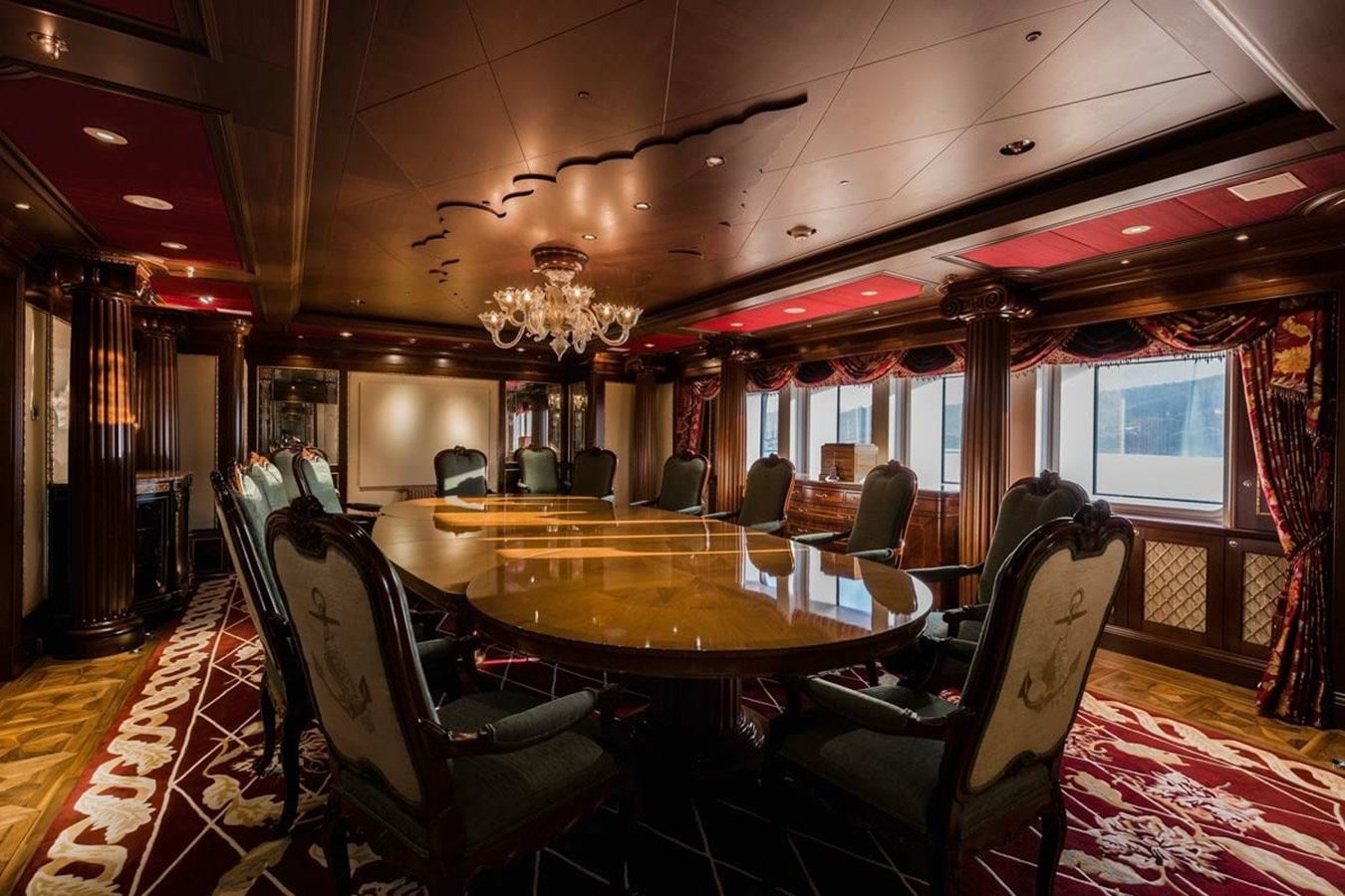 a room with a table chairs and a large window aboard PURE Yacht for Sale
