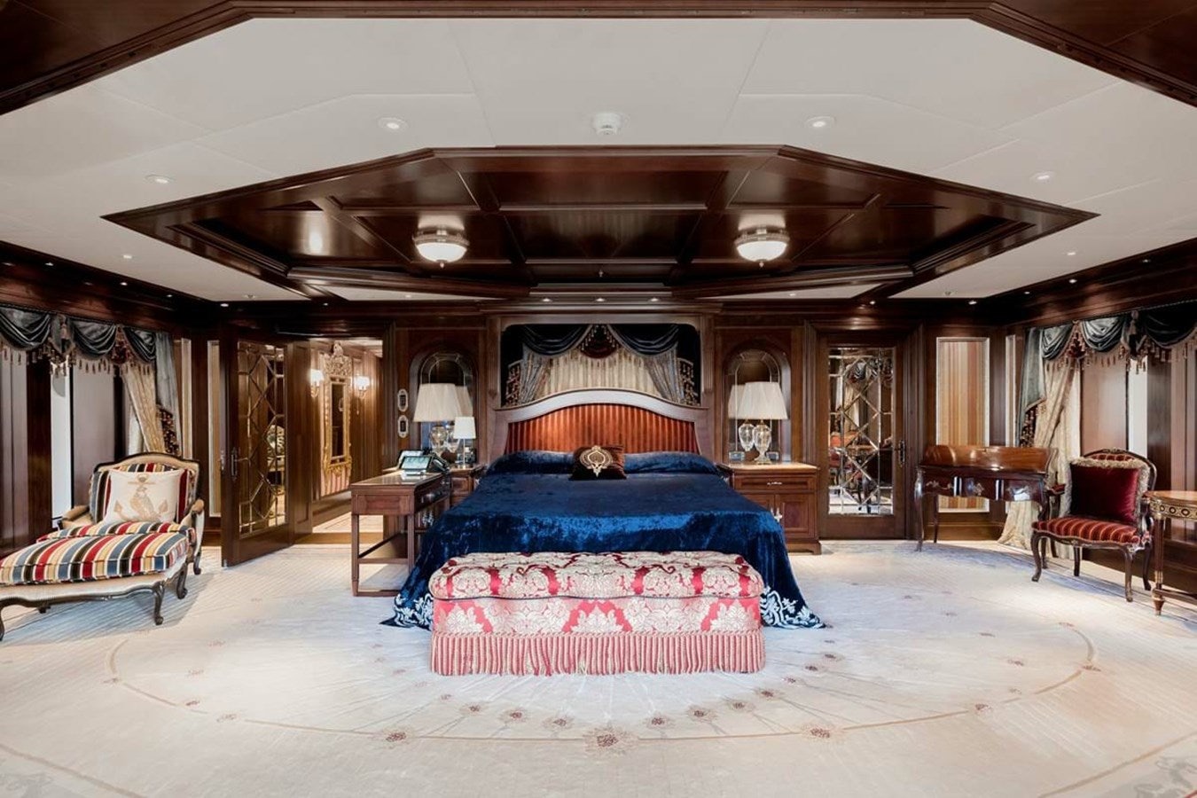 a large bedroom with a large bed aboard PURE Yacht for Sale