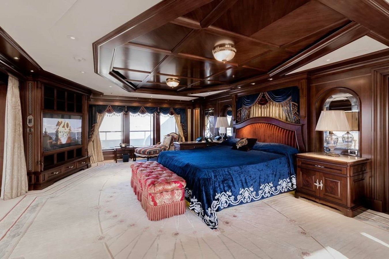 a bedroom with a large bed aboard PURE Yacht for Sale