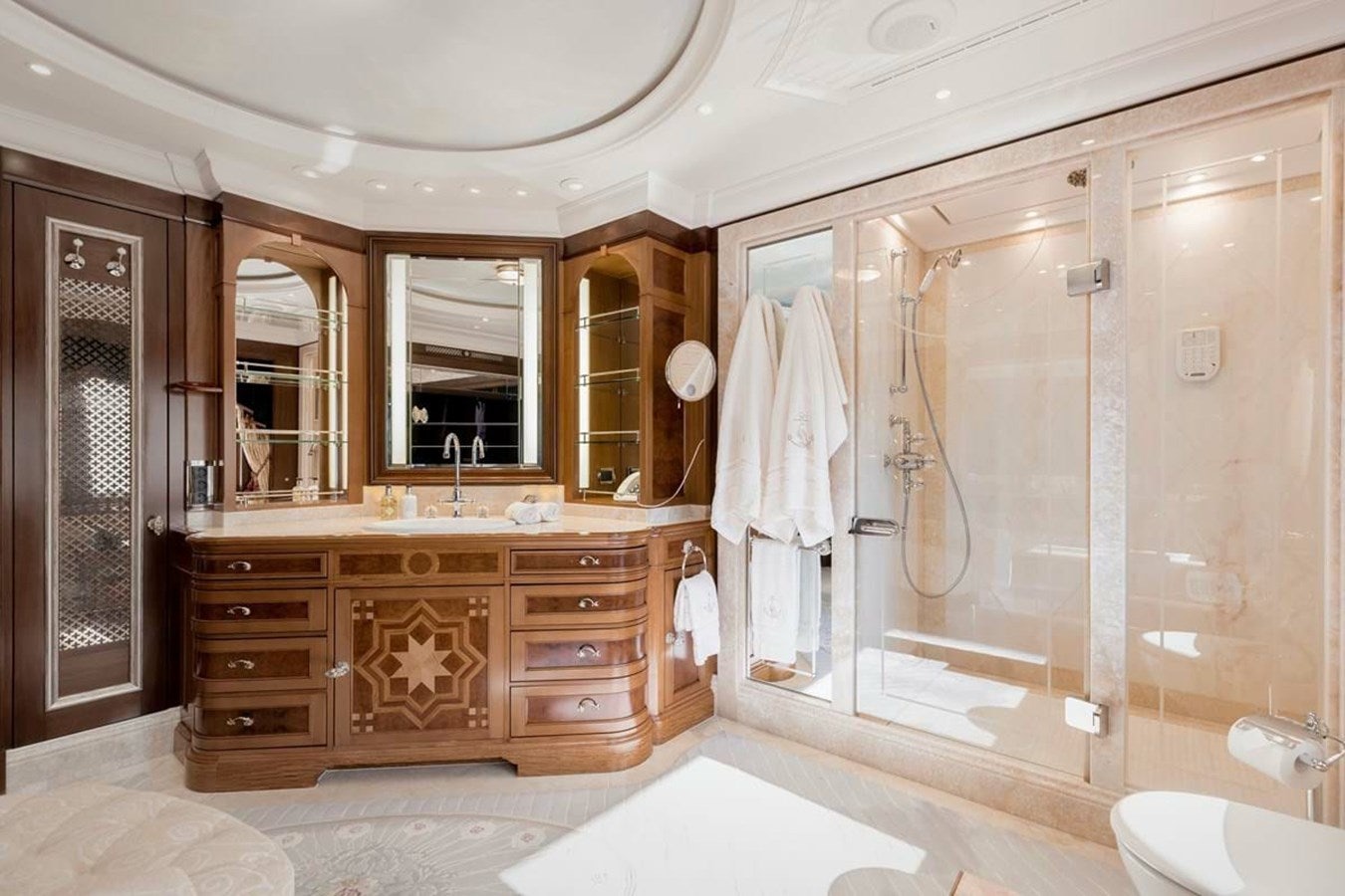 a bathroom with a large mirror aboard PURE Yacht for Sale