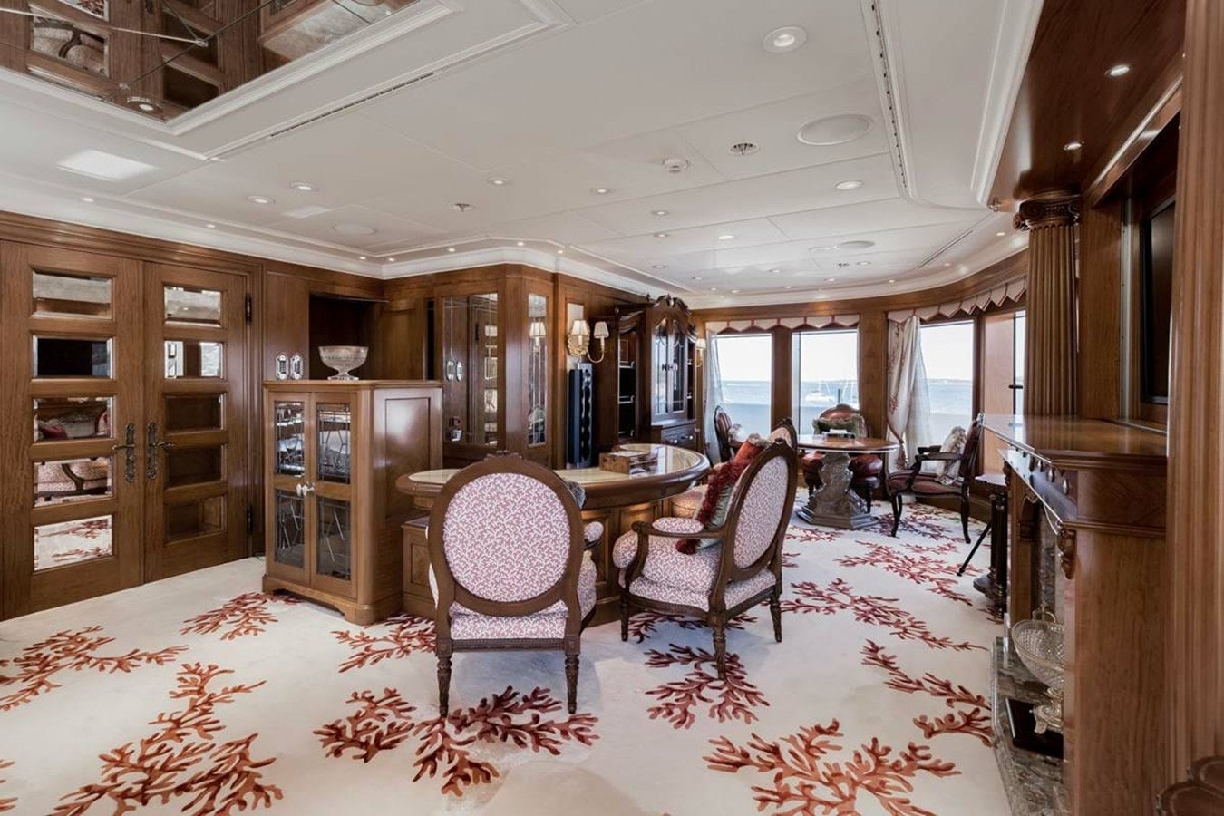 a dining room with a table and chairs aboard PURE Yacht for Sale