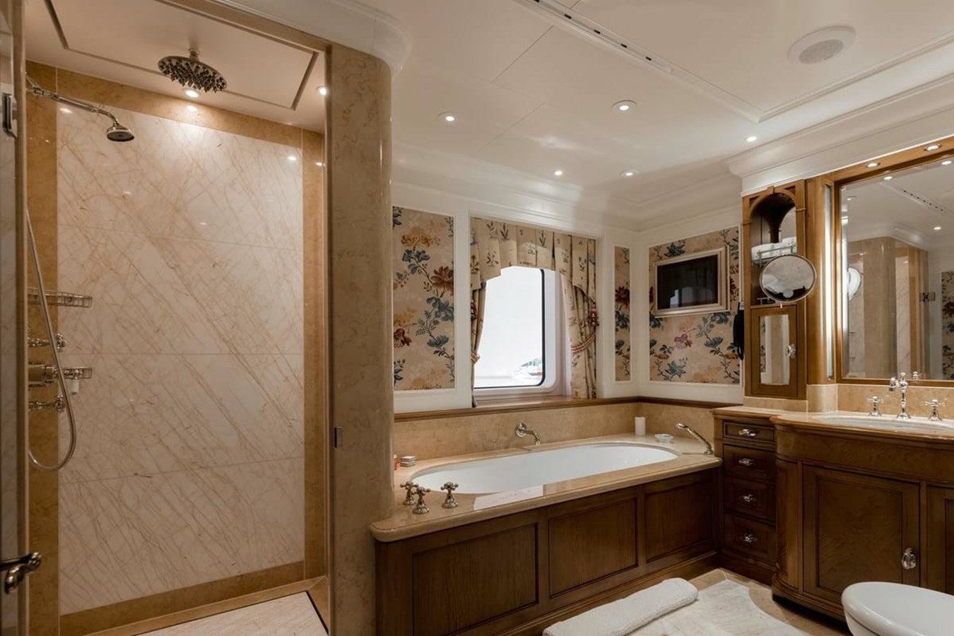 a bathroom with a shower and sink aboard PURE Yacht for Sale