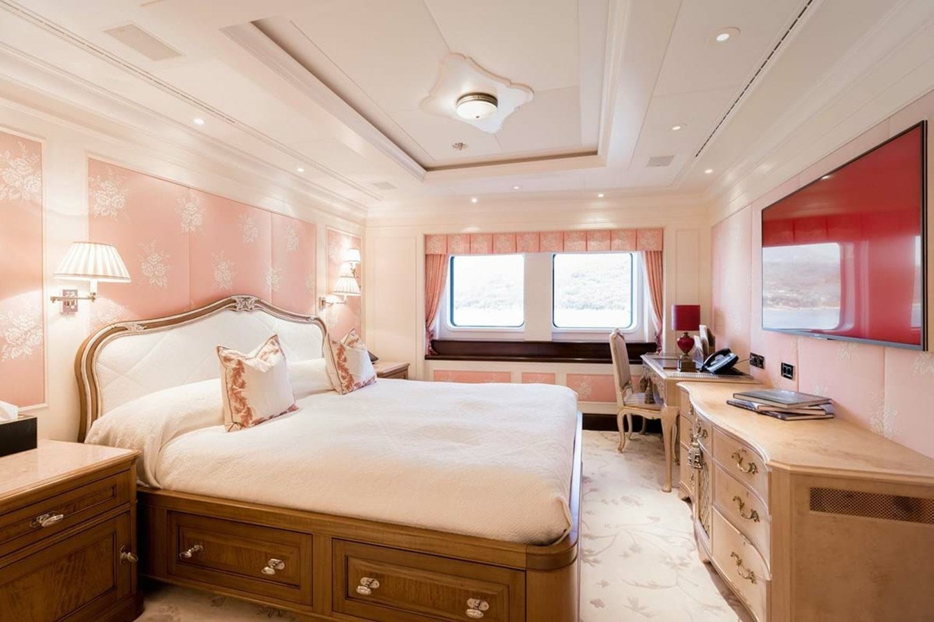 a bedroom with a large bed aboard PURE Yacht for Sale