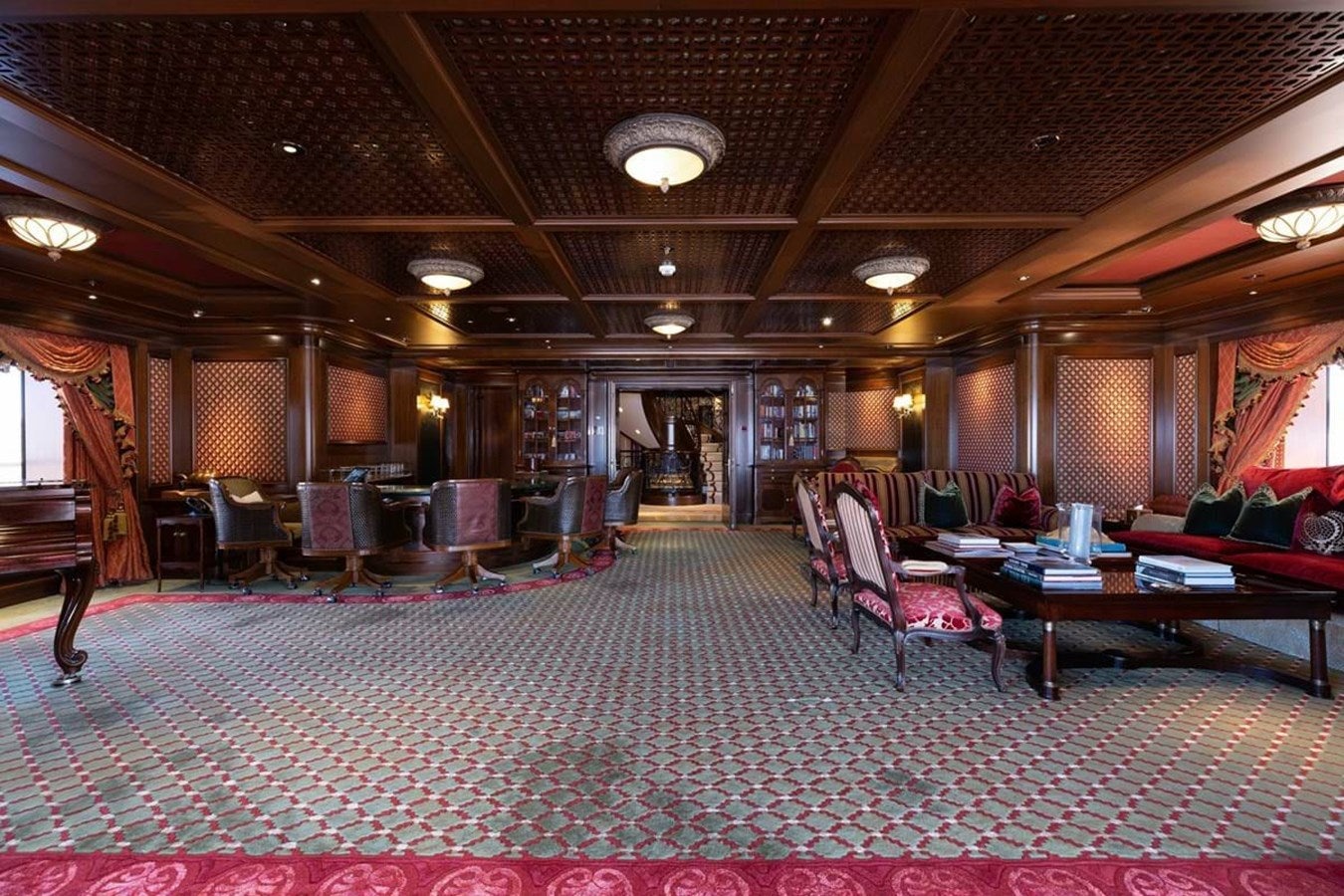 a large room with tables and chairs aboard PURE Yacht for Sale