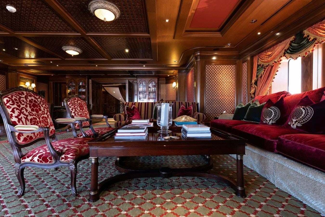 a living room with a couch and a coffee table aboard PURE Yacht for Sale