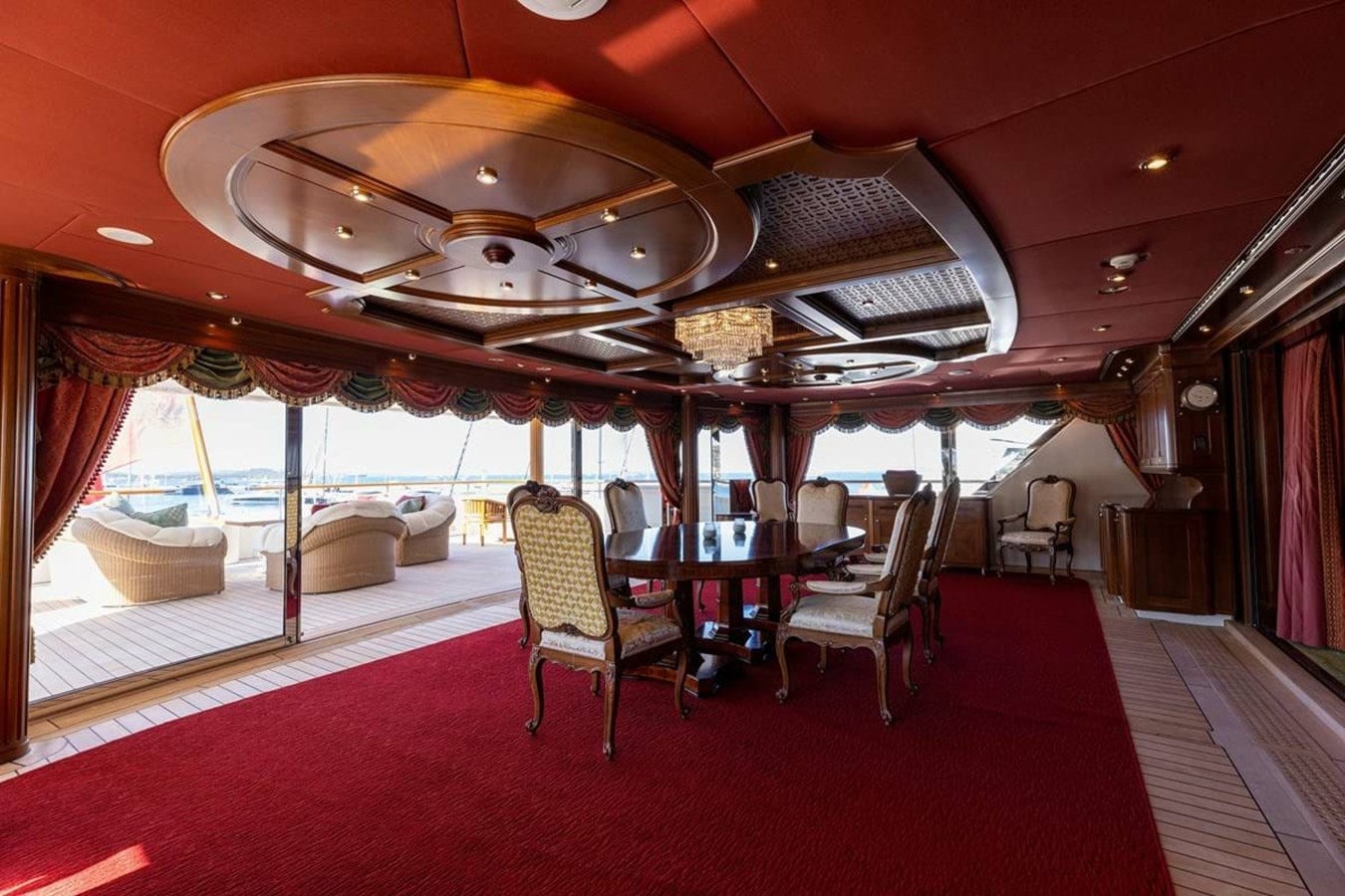 a room with a table and chairs aboard PURE Yacht for Sale