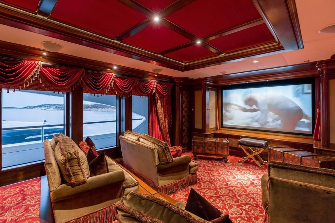 a living room with a large television aboard PURE Yacht for Sale