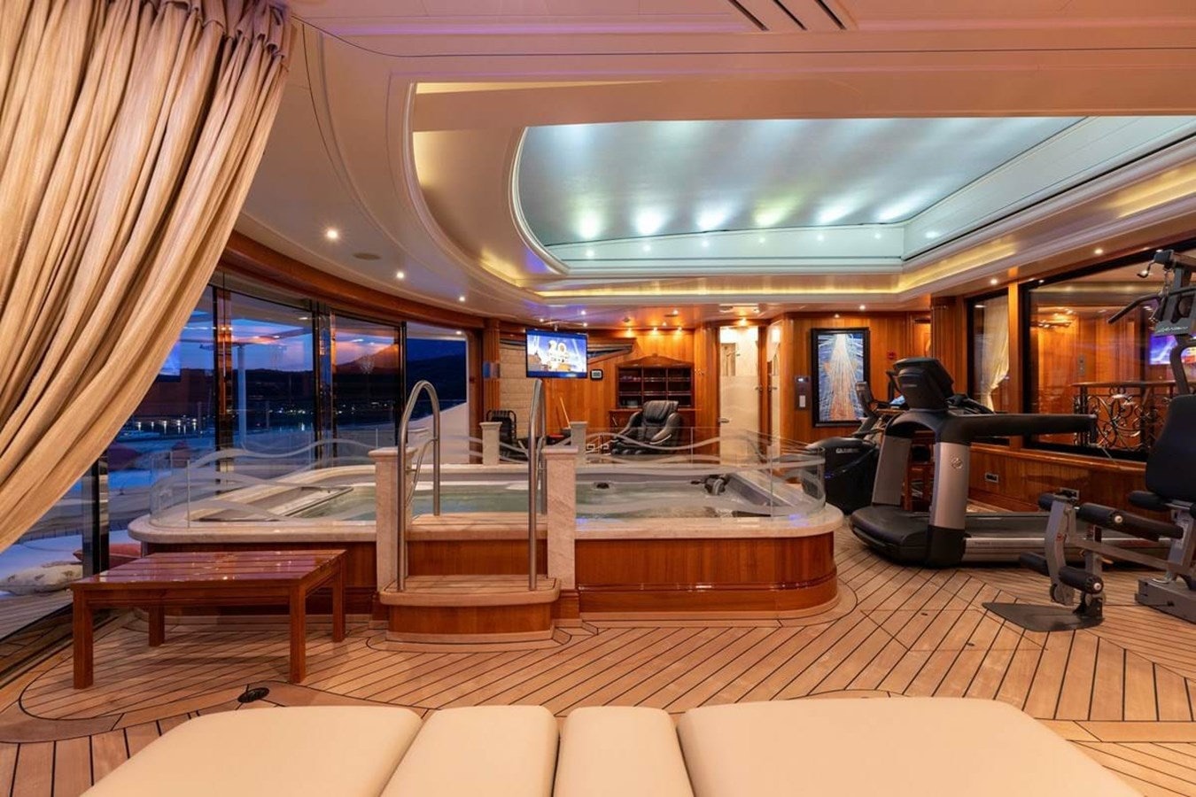a room with a table and chairs aboard PURE Yacht for Sale
