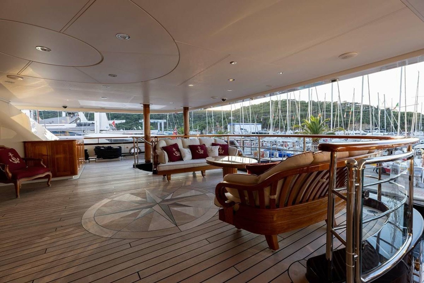 a large room with a wood floor and a large window aboard PURE Yacht for Sale