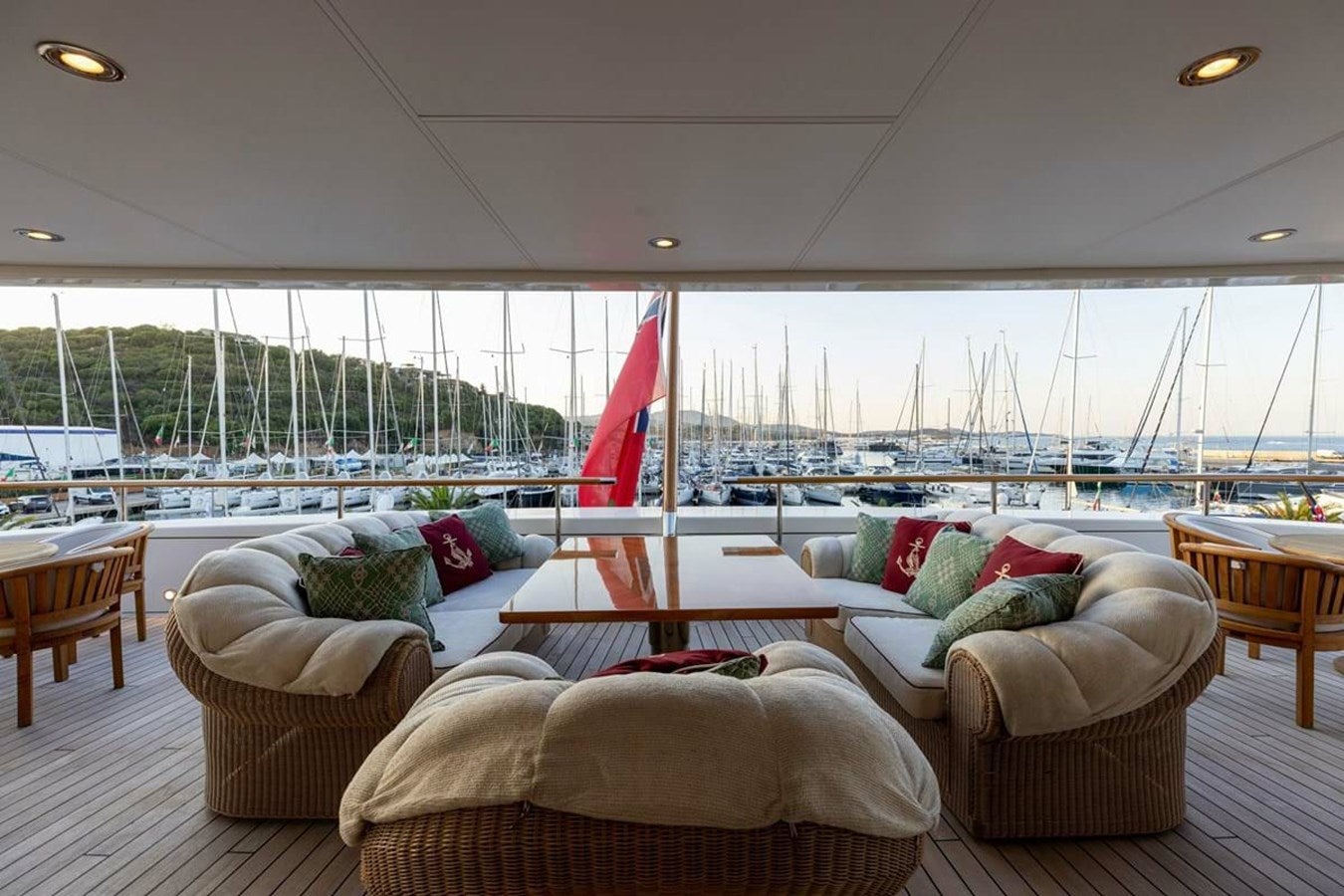 a room with couches and chairs aboard PURE Yacht for Sale