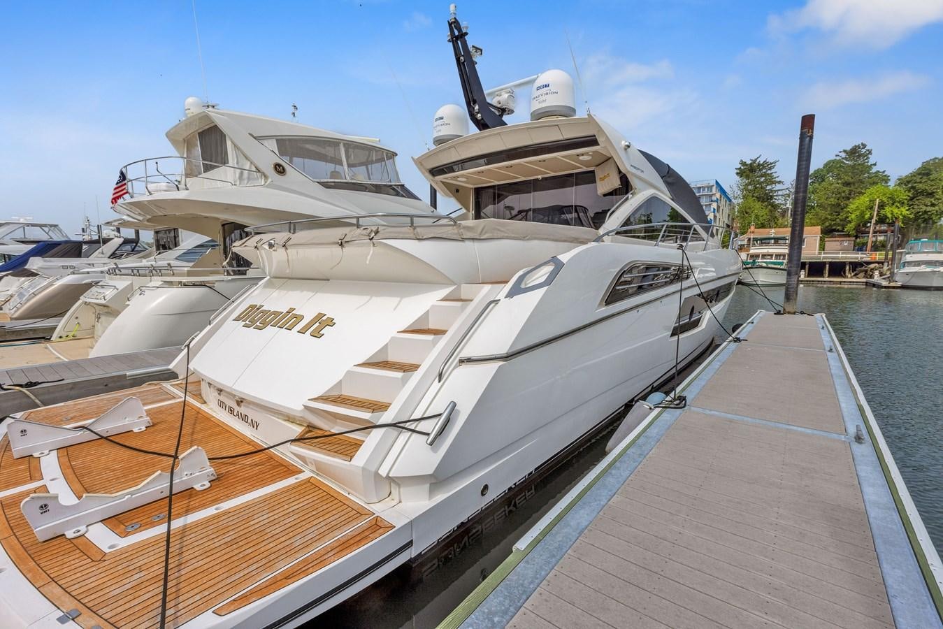 a boat docked at a pier aboard DIGGIN Yacht for Sale