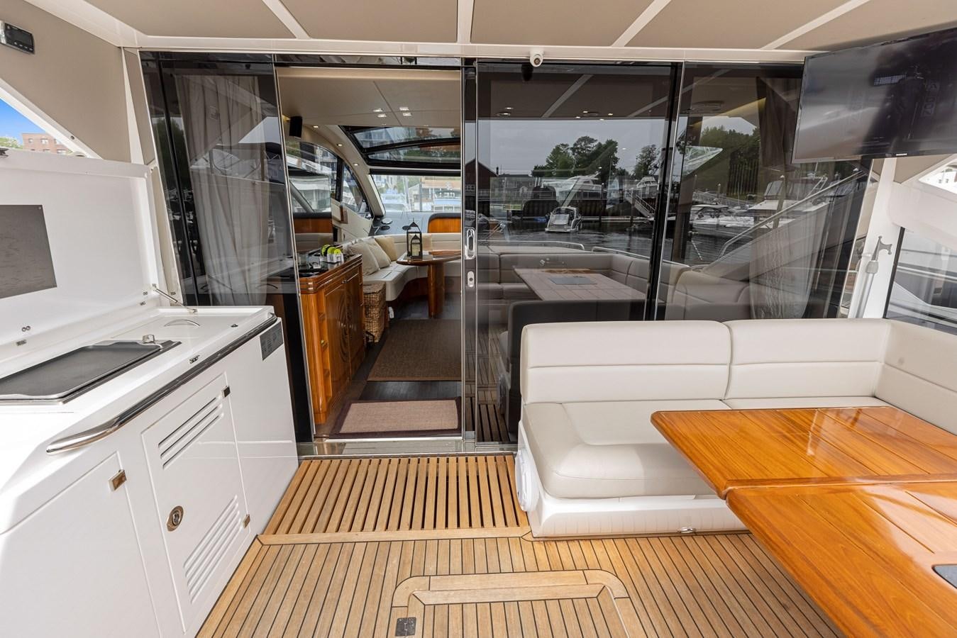 a kitchen with a glass door aboard DIGGIN Yacht for Sale