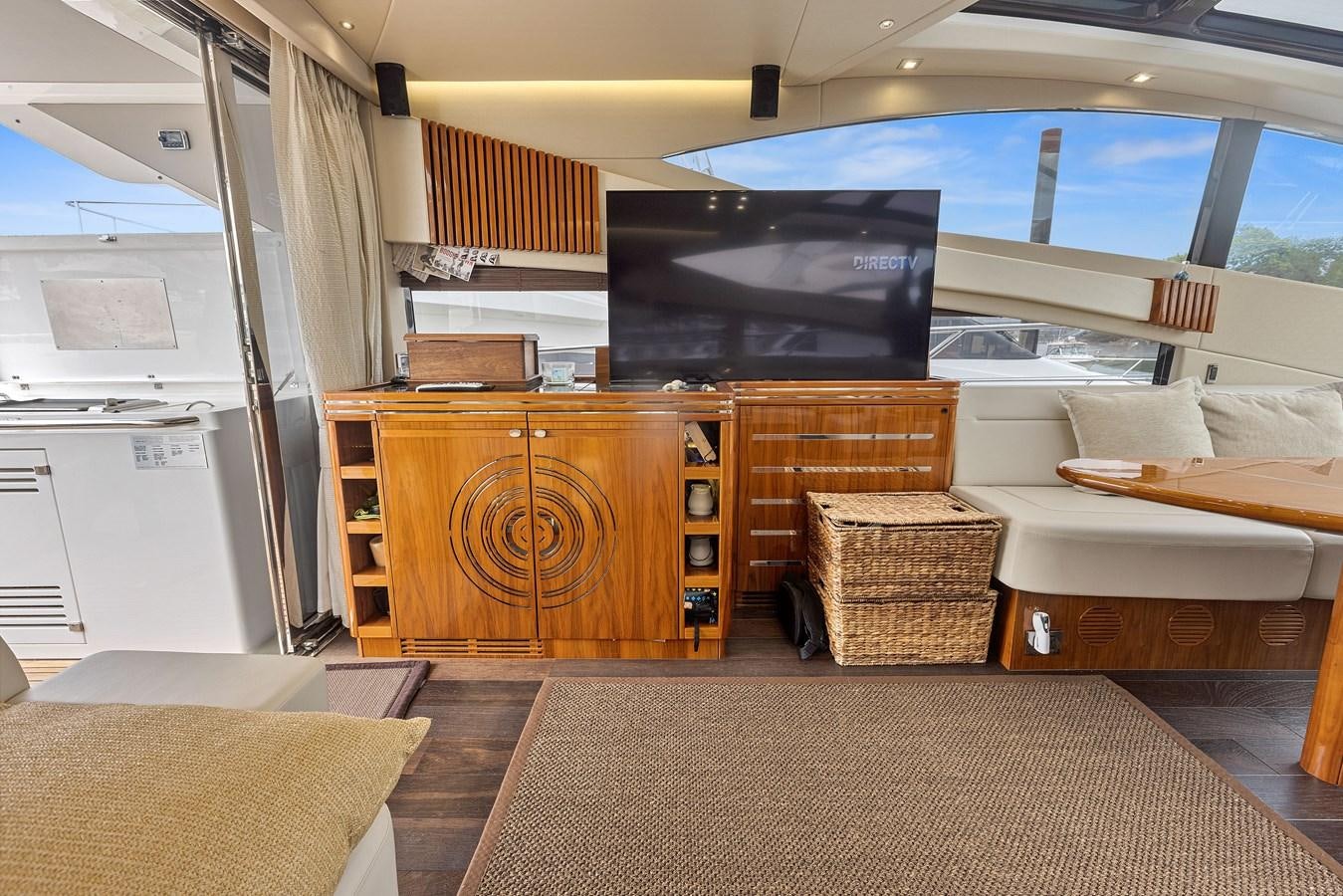 a living room with a large window aboard DIGGIN Yacht for Sale